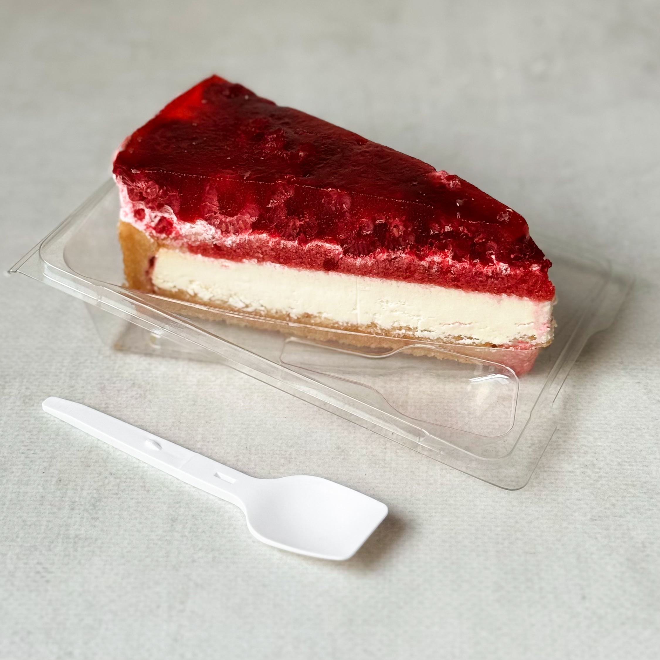 Нежнейший чизкейк из творожного сыра на сливочно-песочном корже, усыпанный ягодами свежей малины в желе. изображение 1