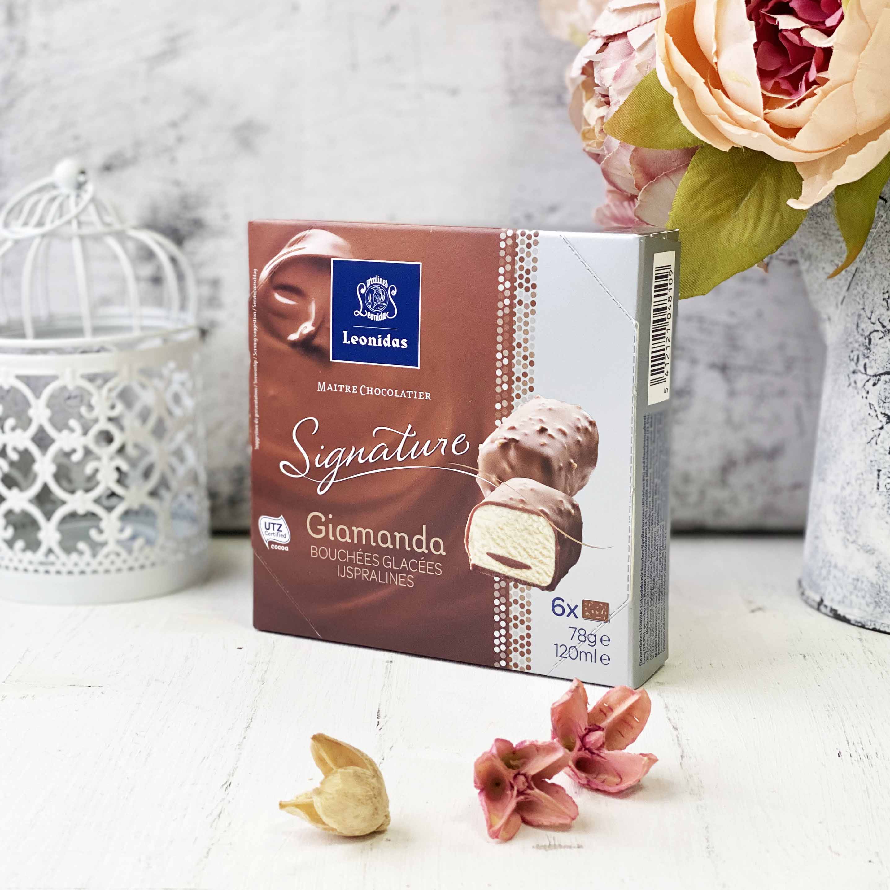 Шоколадные конфеты из ванильного мороженого со вкусом лесного ореха с добавлением сахарного миндаля и фундука, покрытые молочным шоколадом. изображение 2